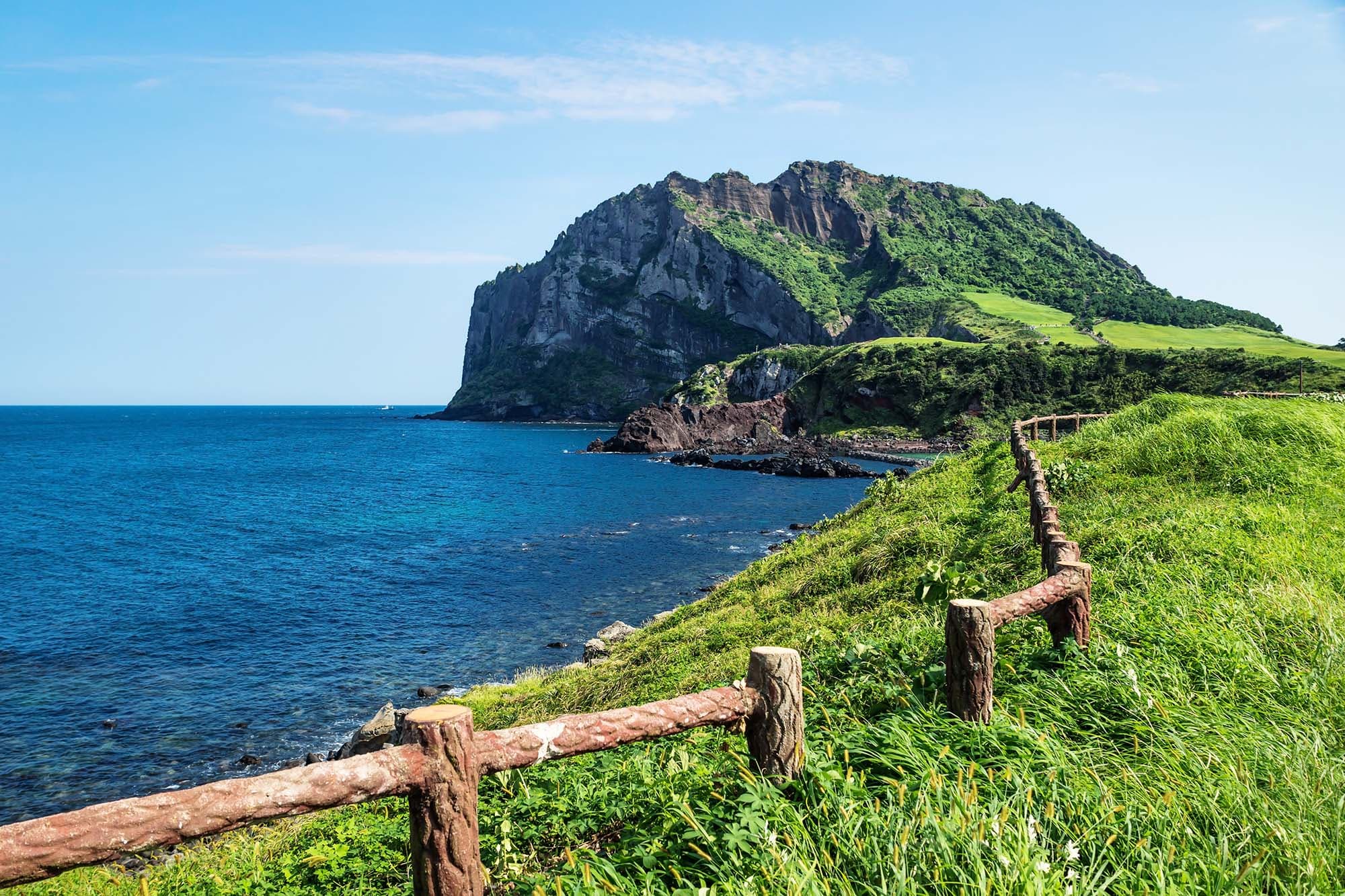 Seongsan Ilchulbong coastline with wooden fence