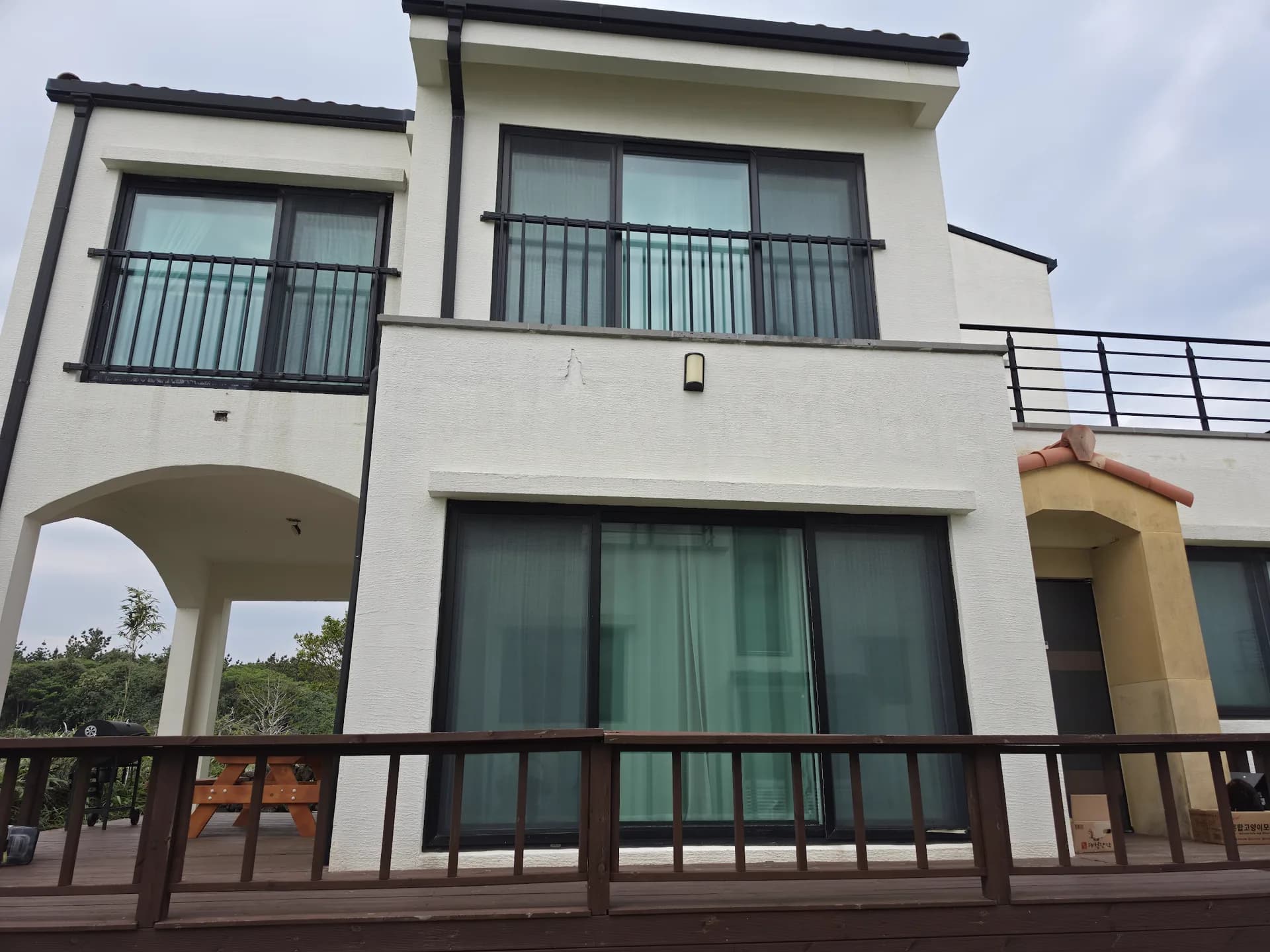 Villa rear elevation with private wooden deck
