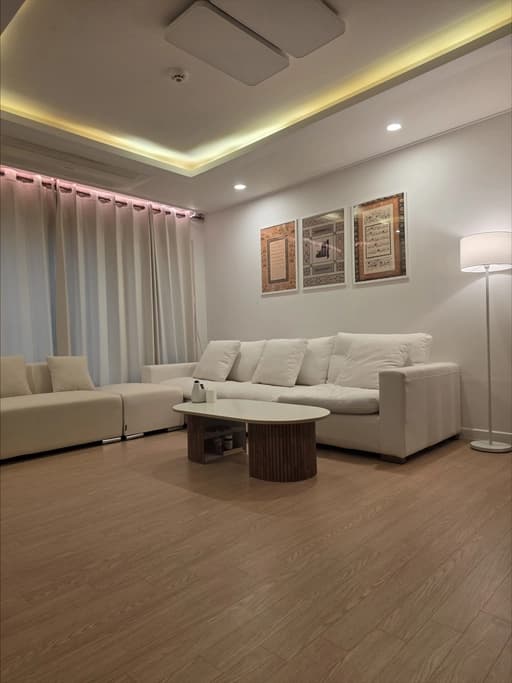 Villa living room with modern sofa and ambient lighting