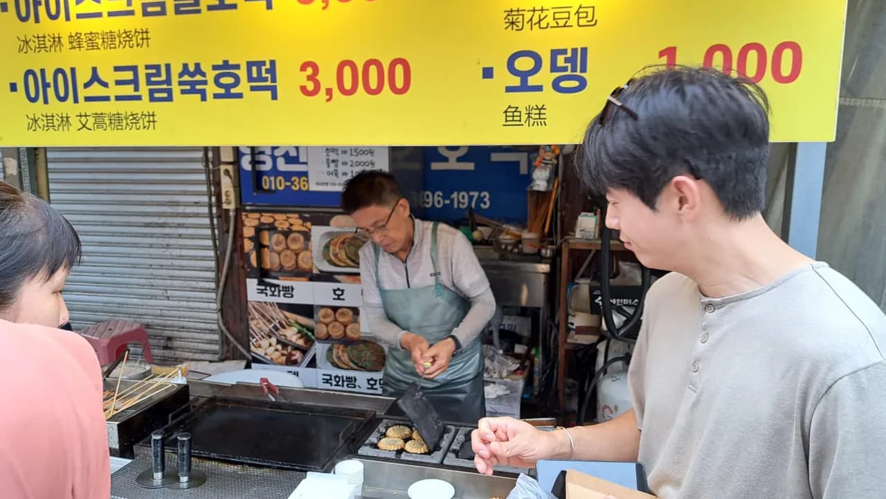 Scooping a special ice cream at a Jeju dessert shop
